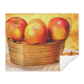 The apples in the gold basket