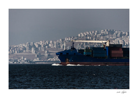 Boat full of containers on the sea in Izmir