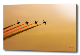 Acrobatic aviation squadron in the sunset