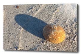 Stone and shadow at the beach