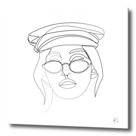 Woman Wearing Sunglasses And Nautical Hat
