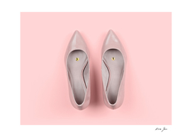 Pair of classic women's beige shoes with pushpin