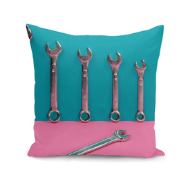 Seven wrenches on a colored background