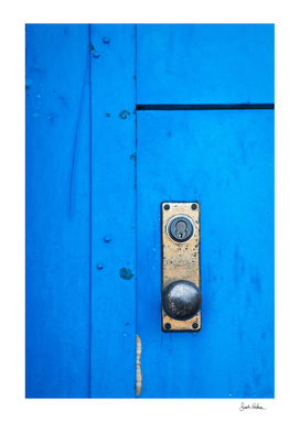 Doorknob on a Blue Door