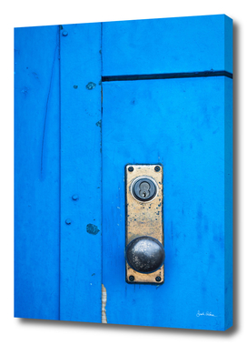 Doorknob on a Blue Door