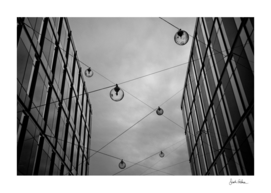 Glass Hanging Lamps Across Buildings