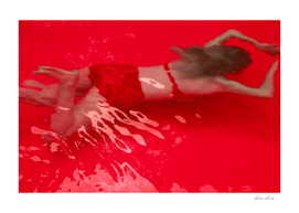 FORUM FEMME SWIMS IN THE RED
