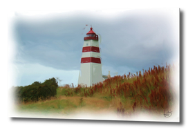Lighthouse striped on beautiful sea shore