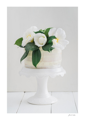 Naked wedding cake with camellias