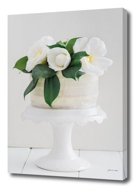 Naked wedding cake with camellias