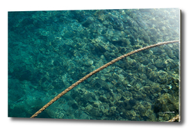 Rope over clear water
