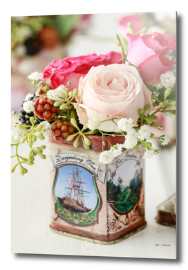 Roses and blackberries in one floral arrangement.
