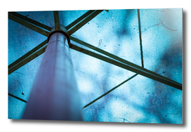 Abstract image of a blue parasol with metal frames