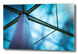 Abstract image of a blue parasol with metal frames