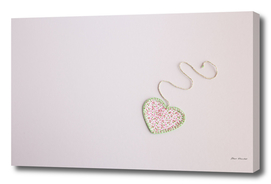 Heart-shaped cloth patch on white background