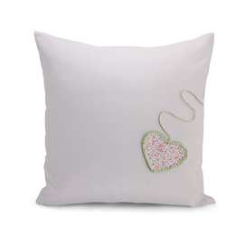 Heart-shaped cloth patch on white background