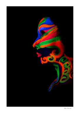 Woman with make up art of glowing UV fluorescent powder