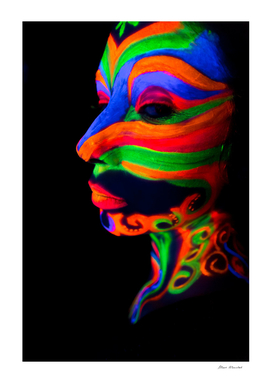 Woman with make up art of glowing UV fluorescent powder