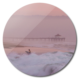 Surfer at Sunset in Manhattan Beach, Ca.
