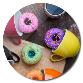 Colorful fancy donuts with black coffee