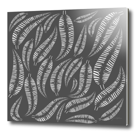 Abstract white bird feathers on a gray background or palm