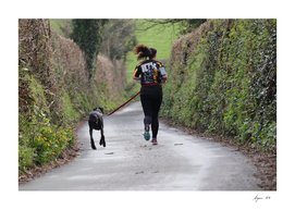 Woman Jogging with Dog