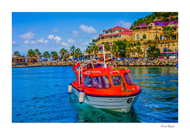 Orange Lifeboat Across Colorful Bay
