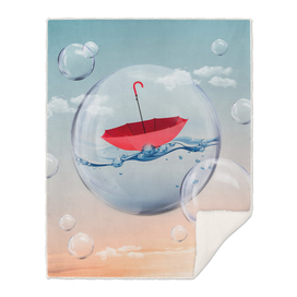 red Umbrella drifting on water in a bubble