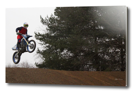 Jump of a motorcyclist during a Motocross Race