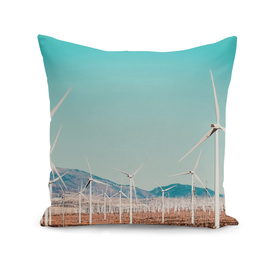 Wind turbine with mountain background in the desert