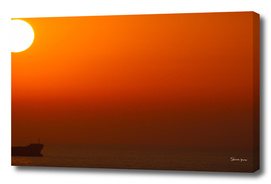 Orange Sunset over the Ocean with one ship