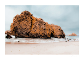 Big stone in the sandy beach at Pfeiffer Beach, Big Sur
