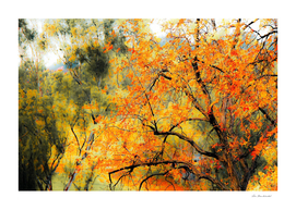tree branch with autumn leaves and green tree background