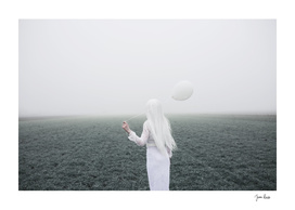 Girl and white balloon