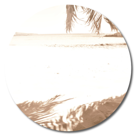 Beige palm shade on beach