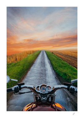 View from motorcycle driver perspective in sunset.