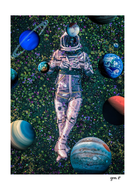 Astronaut lying on flowers and planets