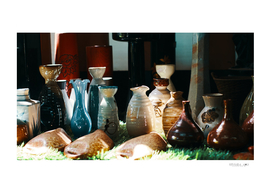 Handmade ceramic vase with shadow on the showroom
