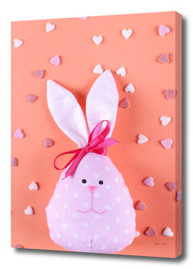 pink hare background with hearts happy easter greetin
