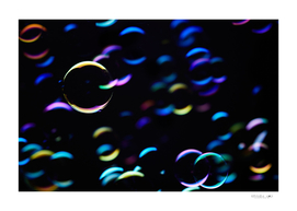 The colorful light reflection on the bubbles in the dark