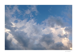 Beautiful abstract blue sky with white gray clouds