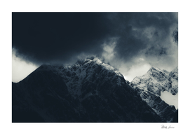 Darkness and storm clouds over mountains