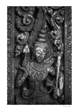 The ancient wooden carving in Thai Buddhist temple