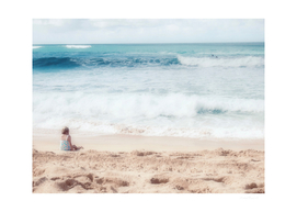 Girl in the blue ocean beach in Hawaii