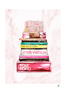 stack of fashion books and a gucci bag