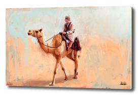 Man riding camel in the desert