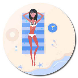 Bikini girl lying on beach : yellow sand and blue