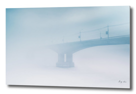 Bridge in winter fog on morning Russia