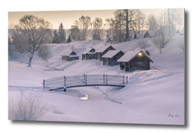 Cozy little houses on hill morning of winter village