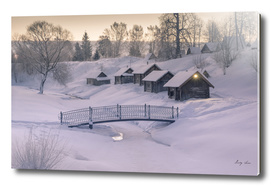 Cozy little houses on hill morning of winter village